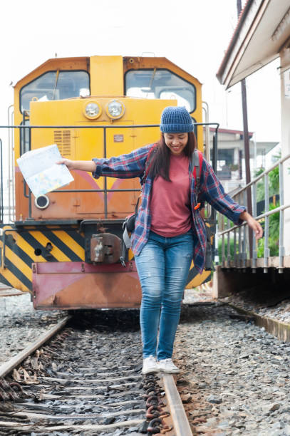 istock Young Asian tourist traveling on train 2119730740