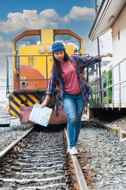 istock Young Asian tourist traveling on train 2119733386