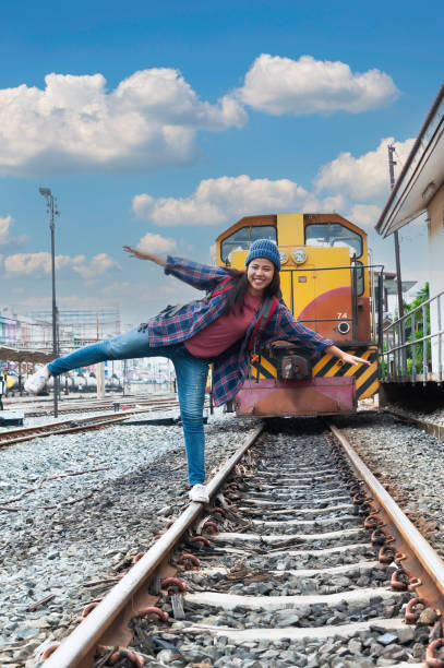 istock Young Asian tourist traveling on train 2119739097