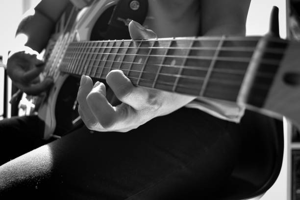 istock Playing an electric guitar 2119756028