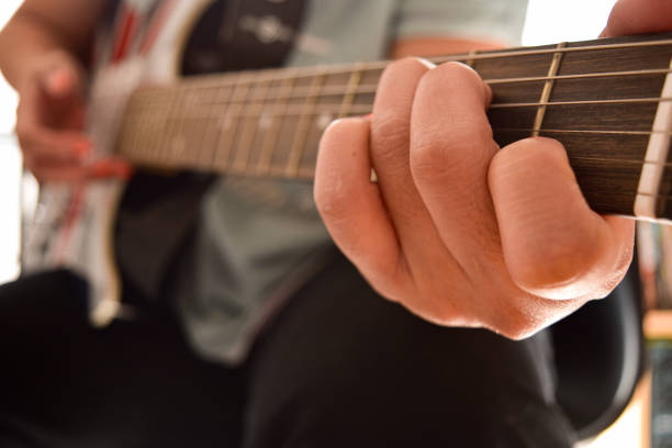 istock Playing an electric guitar 2119757063