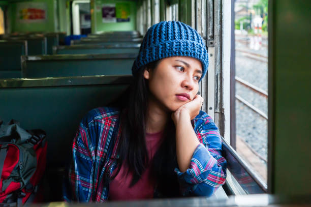 istock Young Asian tourist traveling on train 2119762888