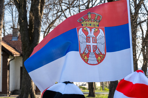 Flag of Poland and the European Union flag against the background of the Presidential Palace in Warsaw.