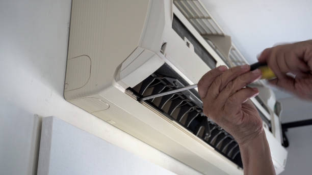 istock Repair and fix air conditioner at home. 2119786187