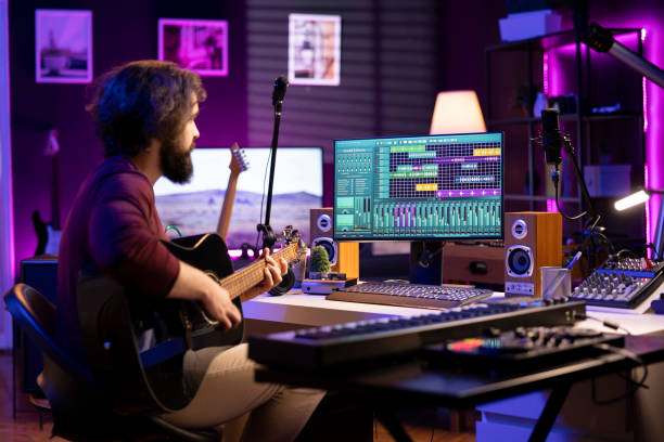 istock Music composer playing guitar to create songs and mix them after 2119820370