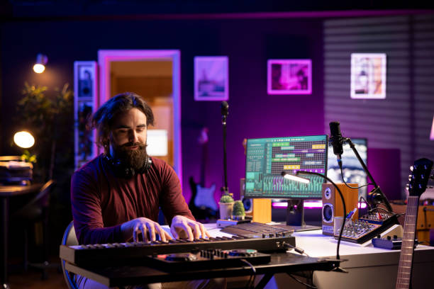 istock Modern artist playing piano notes to record a new soundtrack 2119829028