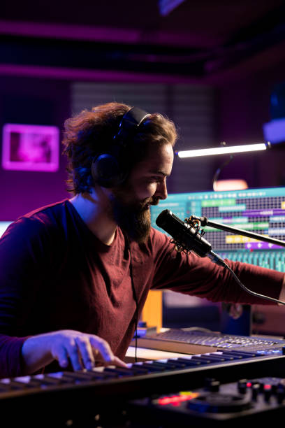 istock Sound engineer recording piano keys notes and singing on microphone 2119838551