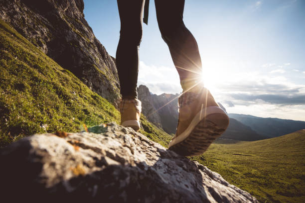 istock Hiking on sunset alpine mountain peak 2119846474