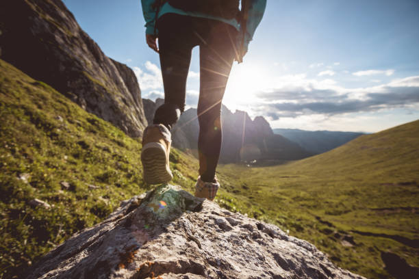 istock Hiking on sunset alpine mountain peak 2119847549