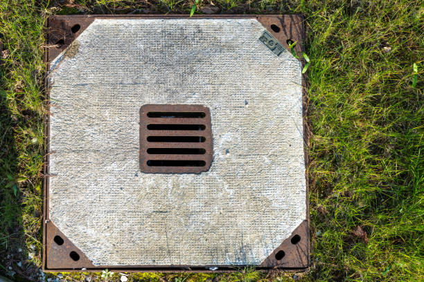 concrete manhole cover in meadow