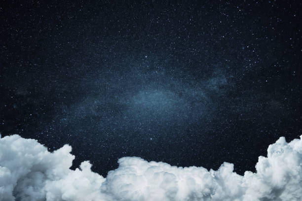 istock Night starry sky with clouds. Space wallpaper, concept. High resolution image 2119865175