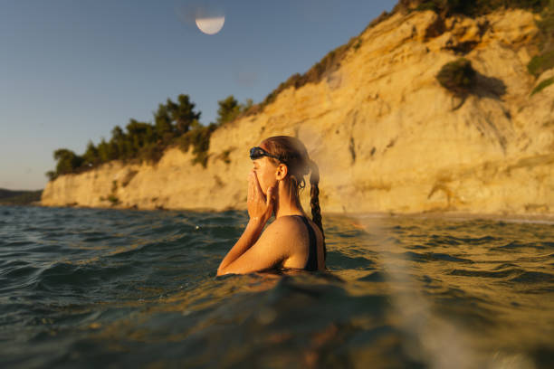 Portrait of a young woman who is having her daily swim training in the sea