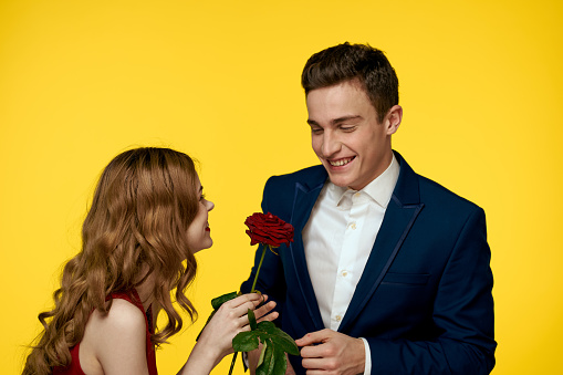 Cheerful man and woman date communication luxury roses fun. High quality photo