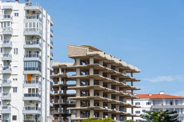 istock Residential building made of frame concrete under construction among residential multi-storey buildings 2119870007