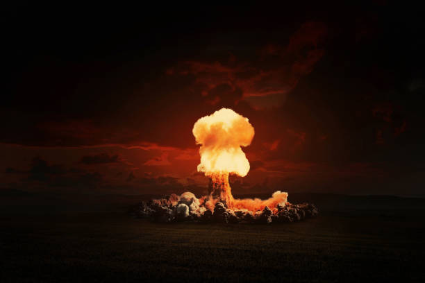istock Terrible bright nuclear explosion in the evening field. World war 3. Apocalypse, creative idea. Concept of nuclear catastrophe. H-bomb danger. Radiation and explosion. Nuclear mushroom 2119895678