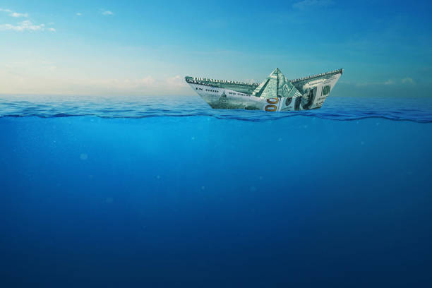 istock Creative dollar paper ship sailing on the high seas with a view underwater. Finance and Insurance, Concept. Crisis and Depth. Business and the sea. 2119895681
