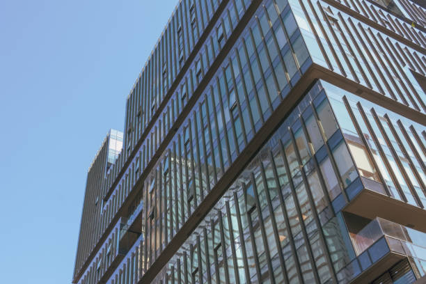istock Abstract glass buildings with blue sky background. 2119935964