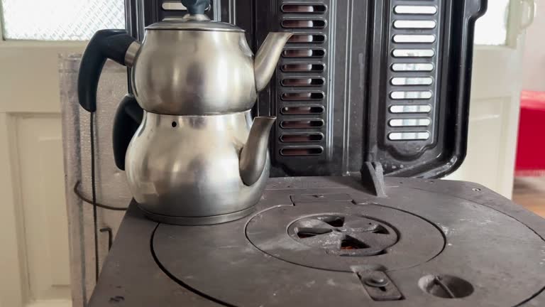 Turkish tea pot on the burning stove 4k stock video