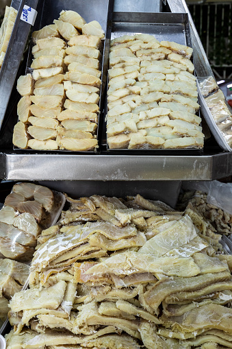 Strips of salted cod in a street market. The salting that consists of drying it with salt.