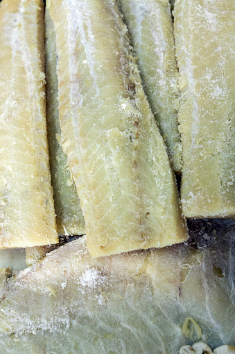Strips of salted cod in a street market. The salting that consists of drying it with salt.