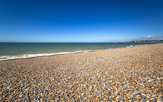 Seaford stony beach summer sunlight English Channel Southern England Europe