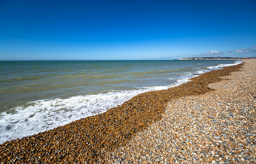 Seaford stony beach summer sunlight English Channel Southern England Europe