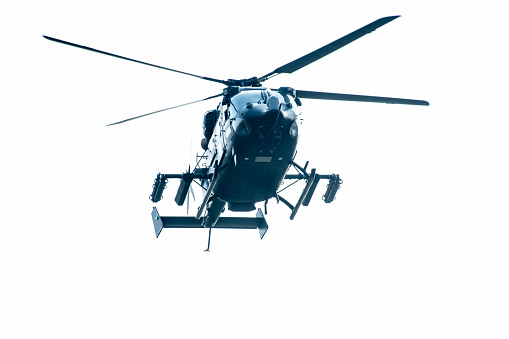 Close-up of helicopter flying on isolated white background