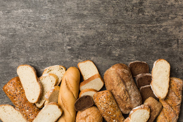 istock Homemade natural breads. Different kinds of fresh bread as background, top view with copy space 2120010490