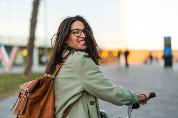 istock Portrait of smiling woman carrying backpack 2120010600