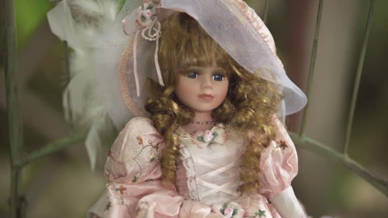 Victorian Doll on a garden chair
