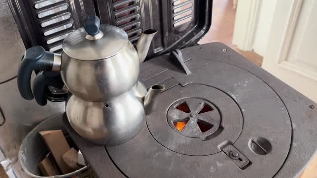 Turkish tea pot on the burning stove 4k stock video