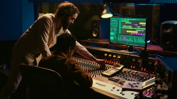 istock Diverse team of musician and audio technician creating a hit song 2120053587