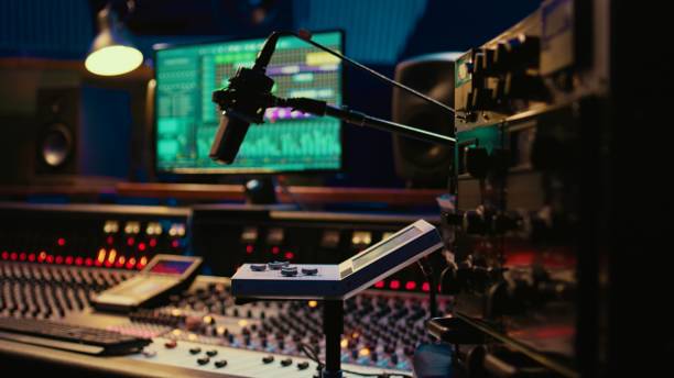 istock Control room desk equipped with motorized faders and amplifier 2120056263