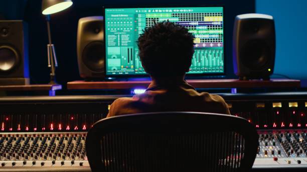 istock African american sound producer editing tracks on audio software and console 2120063839