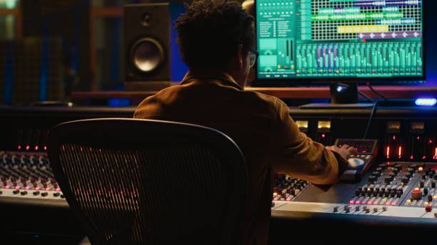 istock Sound designer relaxing on studio chair after mixing and mastering tracks 2120065452