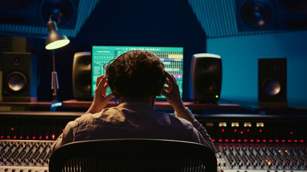istock Mixer producer develops audio by editing recordings and integrating sounds 2120067549