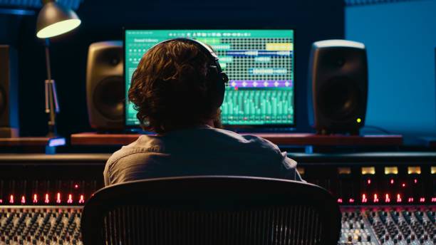 istock Sound producer creates tunes and handling technical equipment 2120073810