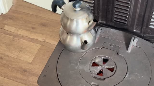 Turkish tea pot on the burning stove 4k stock video