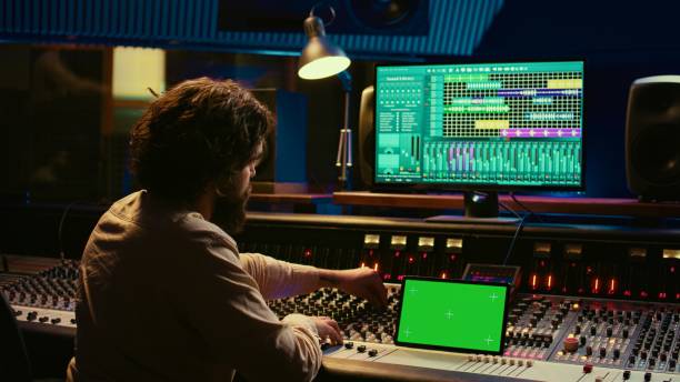 istock Audio technician working with music recording software and editing tunes 2120076435