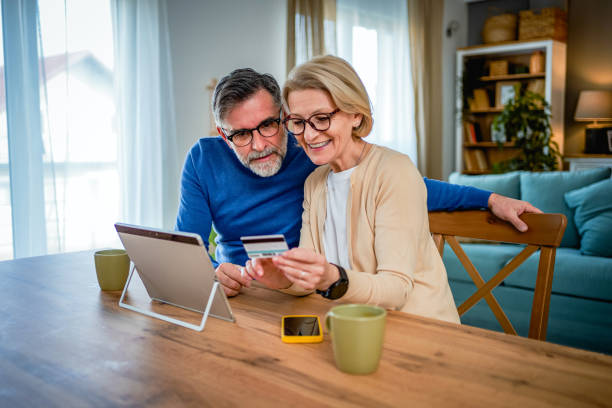 istock Mature couple using tablet for on line payment 2120082813