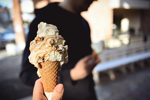 Close up italian ice-cream in a hand.