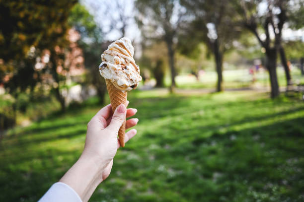 istock Eating ice-cream in a green spring parkland. 2120120167