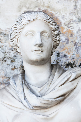 Apollo head sculpture isolated on black background