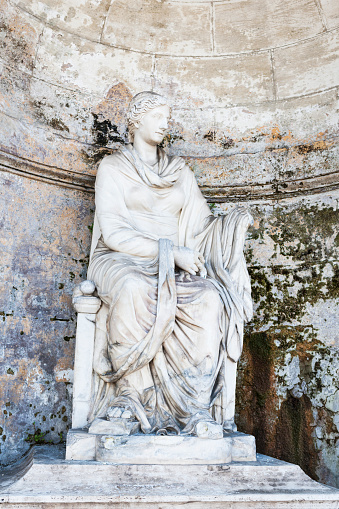 Hygieia the Genius of Health, statue by Alessandro Massimiliano Laboureur at the nymphaeum on Pincian Hill in the city of Rome the capital of Italy.