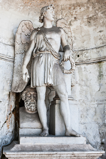 Genius of the Arts, statue by Filippo Gnaccarini at the nymphaeum on Pincian Hill in the city of Rome the capital of Italy.