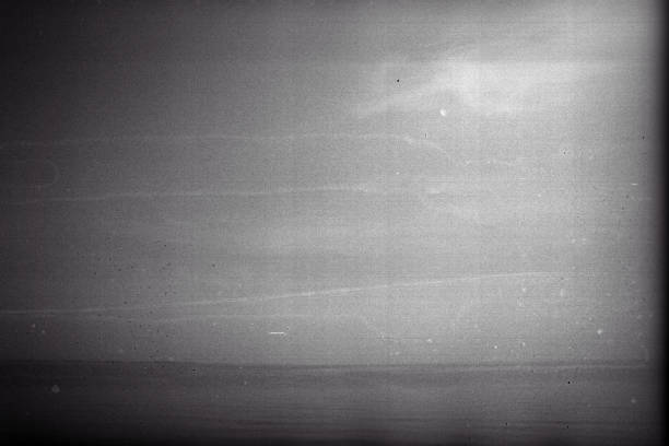 Blank grained film strip texture background with heavy grain and dust