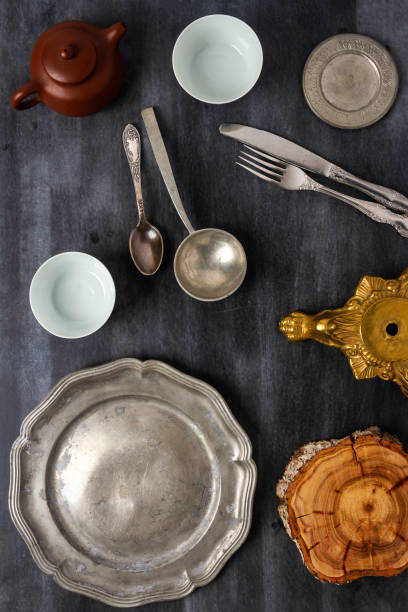istock Various antique vintage dishes on black background 2120165224