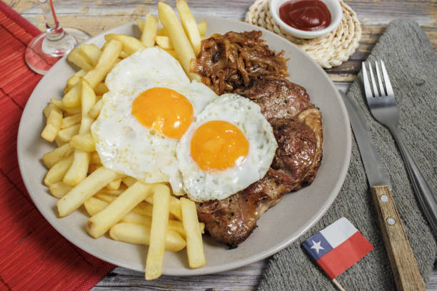 istock Bistec a lo pobre on Wooden Table 2120166766