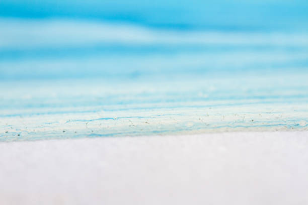 Extreme close up of blue acrylic paint texture showing brush strokes. Selective focus.