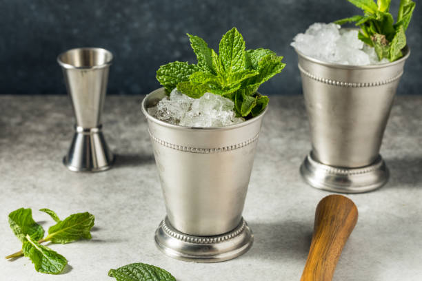 Refreshing Cold Iced Mint Julep Cocktail Refreshing Cold Iced Mint Julep Cocktail with Bourbon for the Derby kentucky derby stock pictures, royalty-free photos & images